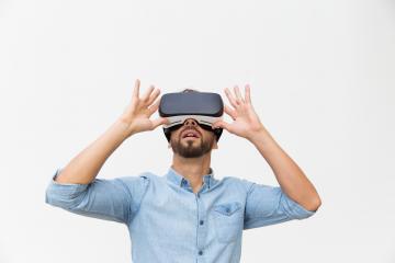 Excited Male User Wearing Vr Glasses Touching Device (2)